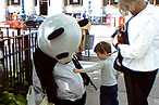 Small Child Attempts to Comfort Sad Panda