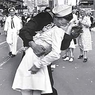 A young couple celebrates in the streets upon hearing the news.