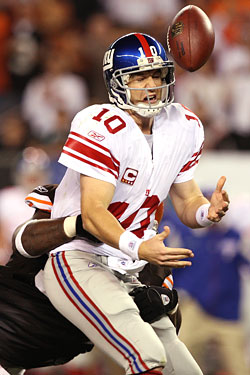 Jealous of David Tyree's "helmet catch," Eli Manning attempts a "helmet throw," with disastrous results.