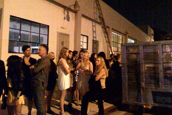 Guests waiting to get in lined up next to a glam garbage bin. The metaphor was not lost on us.