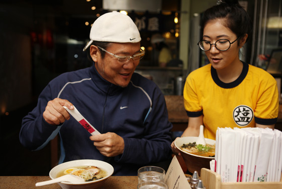Morimoto braces himself for a third bowl of ramen at Setagaya.