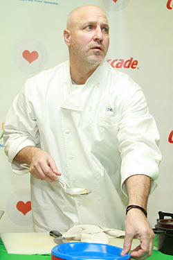 Chef Tom Colicchio, listening for sounds of a blocked windpipe.