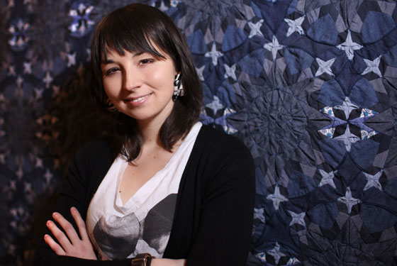 Kwilti designer Julie Floersch in front of one of her recycled-denim quilts.