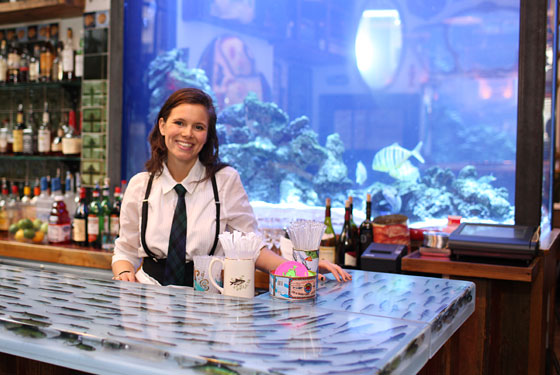 Alexis Sarandon by the notorious fish tank at the John Dory.