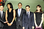 MObama Has a Poufy Black Dress on Now! Carla Looks Great, Too! (Updated)