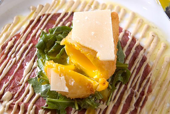 The crispy egg at Ouest is poached and then fried.