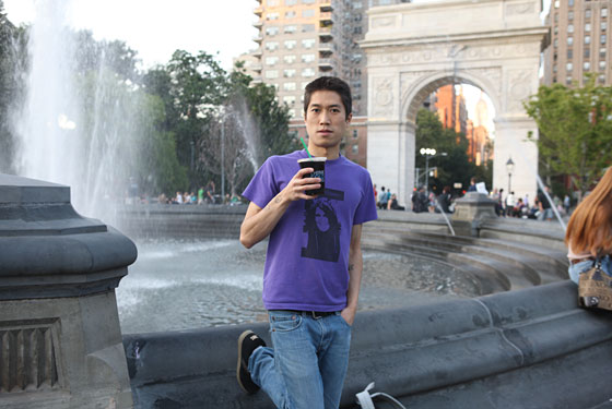 Writer Tao Lin sips iced Think Coffee in Washington Square Park.