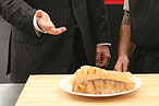 Alton Brown and Seamus Mullen consider a plate of ... something.