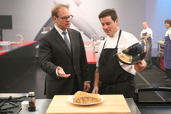 Alton Brown and Seamus Mullen consider a plate of ... something.