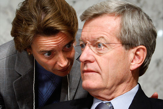 Senators Max Baucus and Blanche Lincoln look frightened. Maybe because they are about to kiss in front of everybody.