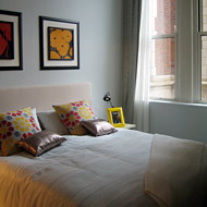 The bedroom of a model apartment at P.S. 90 in Harlem, with ten-foot windows.