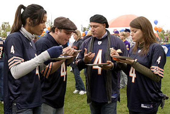 Top Chef judges in a huddle.