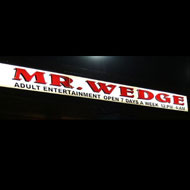 Why Do the Shadiest Bars Have the Cheesiest Names?