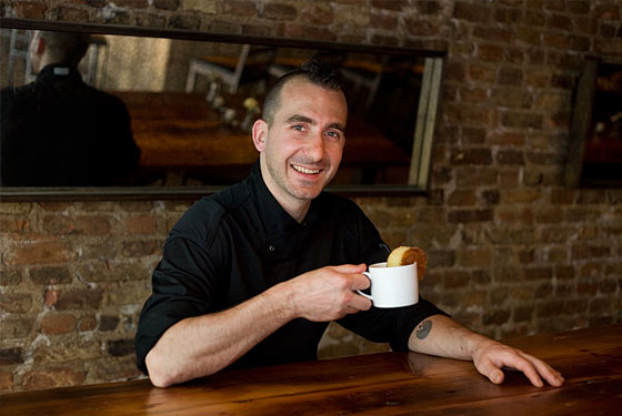 Forgione eats his cake-and-coffee breakfast at Restaurant Marc Forgione.