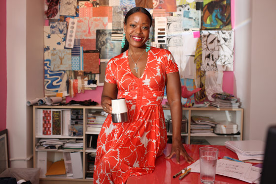 Reese sips a mug of tea in her studio.