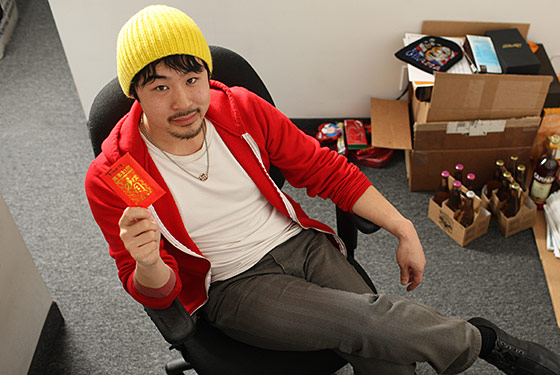 Francis Lam at his office, with a red envelope from Mom.