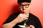 Huang, fighting a hangover to eat some falafel.