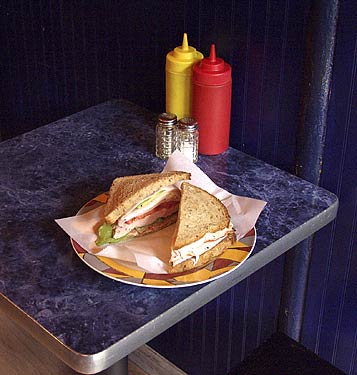
The menu's #9 is a smoked turkey sandwich layered with avocado, bacon and tomato on rye bread. 