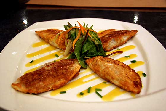 
Popular pan seared spicy black bean dumplings with miso-mango sauce.

